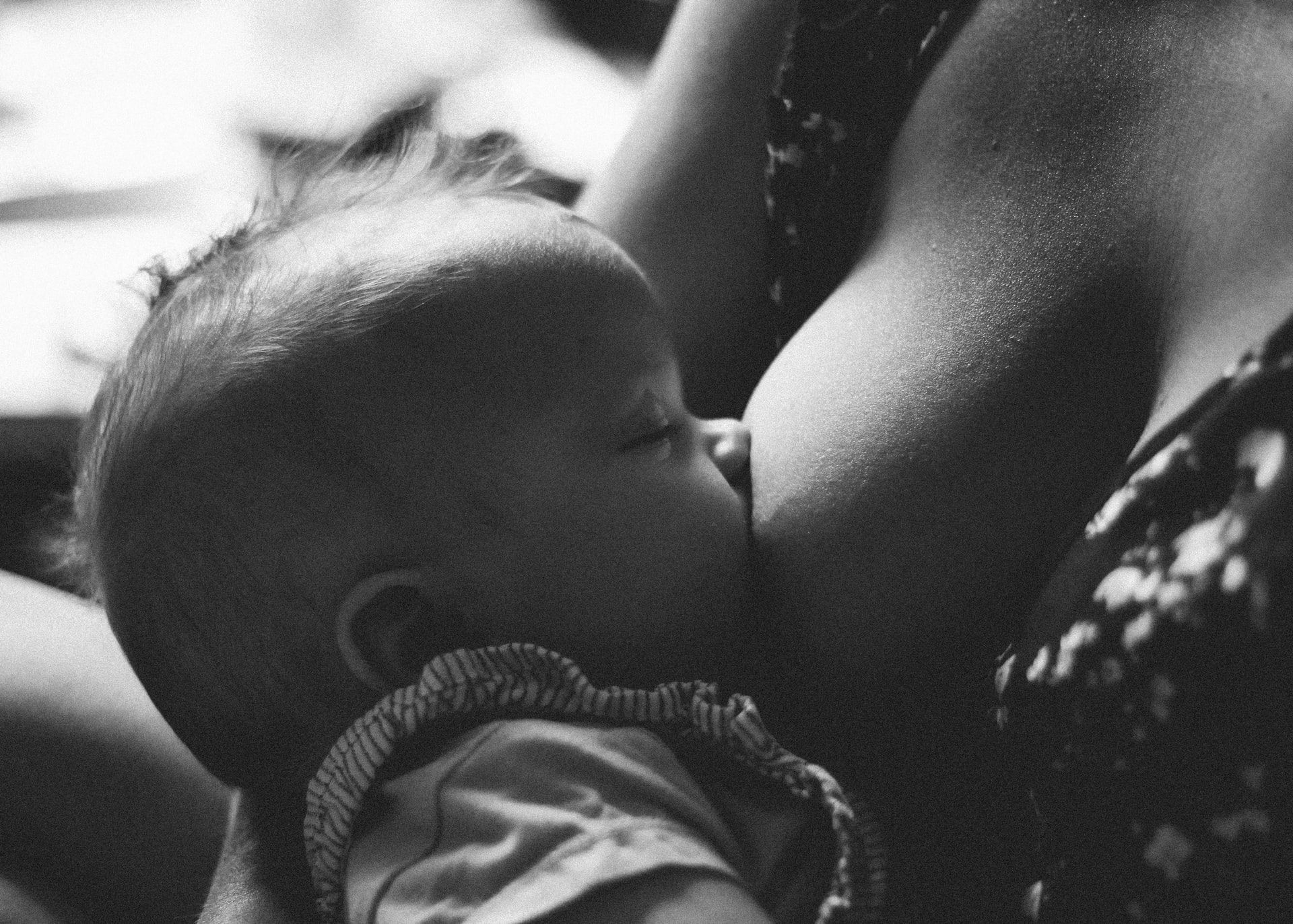 a woman breastfeeding her baby